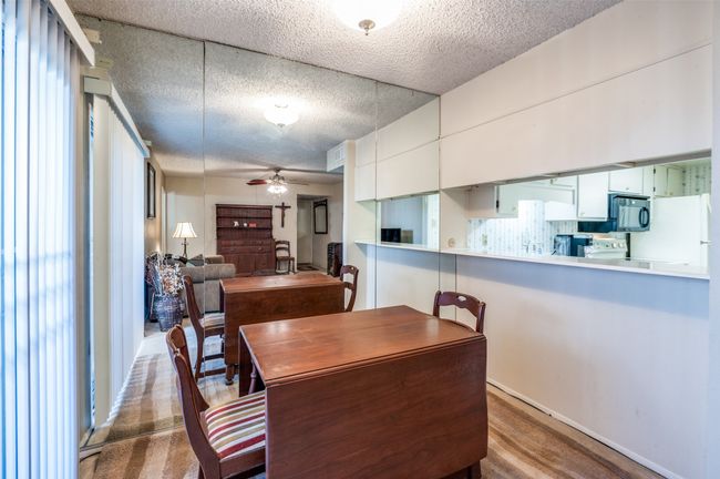 Dining space with a textured ceiling and a ceiling fan | Image 12