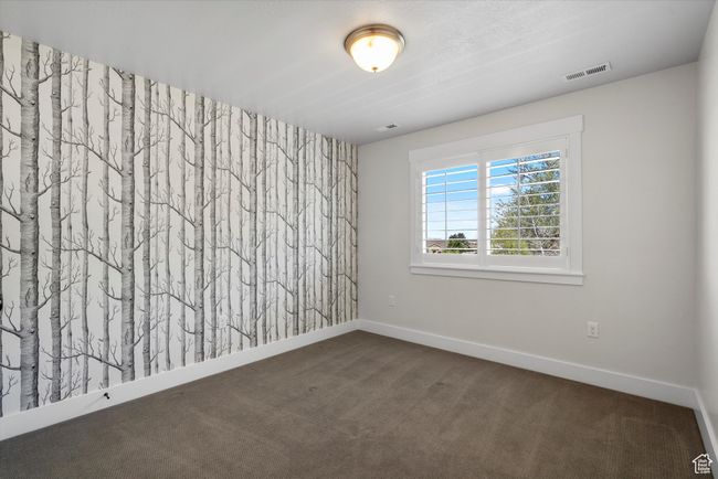 Empty room featuring baseboards, visible vents, and carpet floors | Image 39