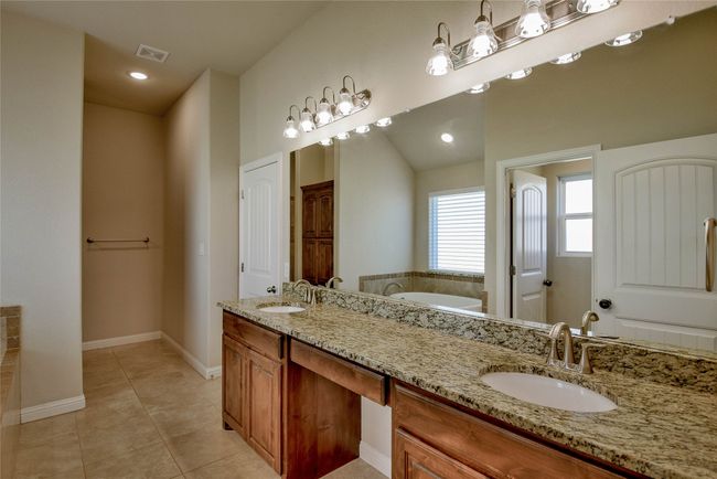 Master Full bath with double vanity, a sink, tile patterned flooring. | Image 20