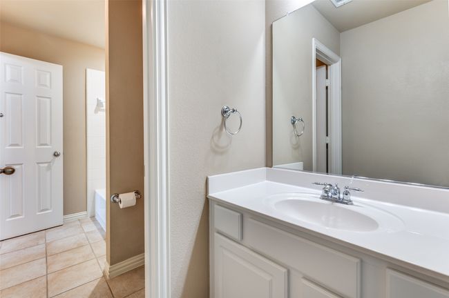 Jack & Jill bathroom with vanity and tile patterned floors | Image 18