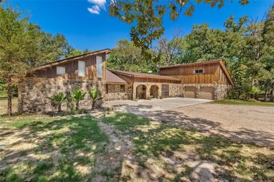 View of front facade with a garage | Image 1