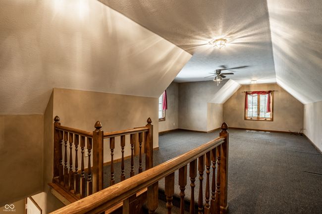 Large bonus room above the garage with a full bath | Image 43