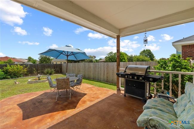 back covered porch with extended patio | Image 25