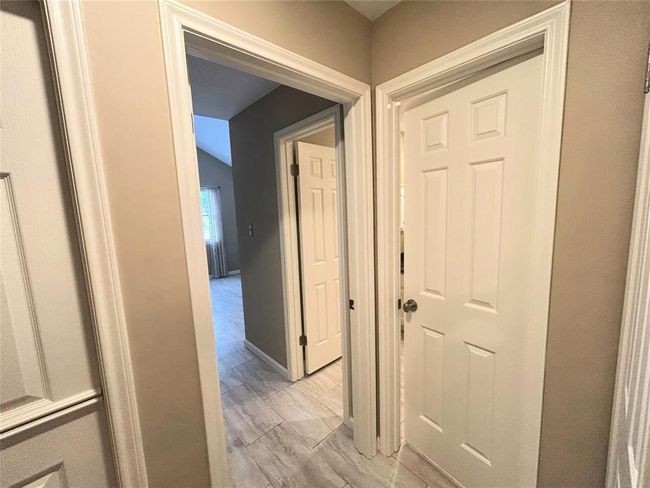 When you get to the top of the stairs you will see the primary bedroom on the left (with a dutch door), the 2nd bedroom which as a door leading into the bathroom and an additional door from the bathroom back into the hall. | Image 30