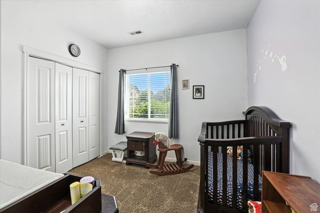 Bedroom featuring carpet flooring and a closet | Image 18