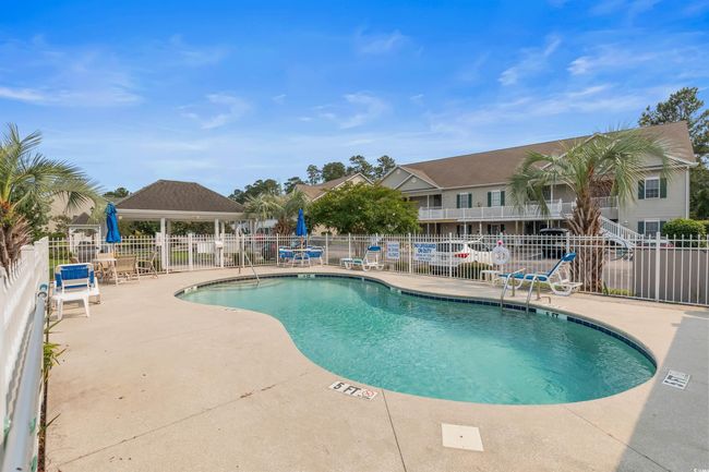 Community pool featuring a patio and a gazebo | Image 37
