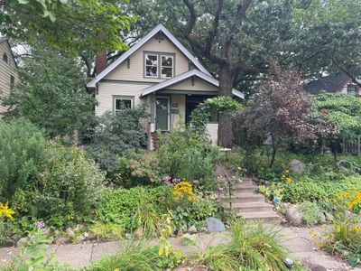 This home is surrounded by tranquil greenery and gardens | Image 2