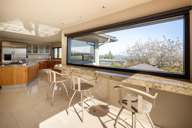 Interior space featuring outdoor wet bar and an outdoor kitchen | Image 10