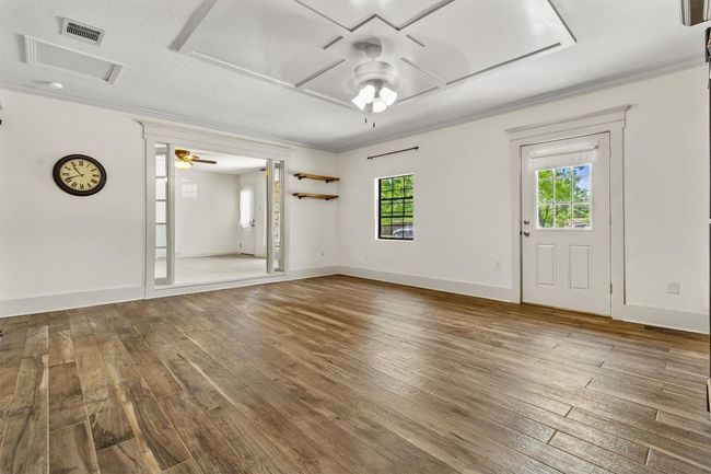 The main living room offers plenty of space to spread out, making it a comfortable spot for everyday living or hosting friends and family. | Image 5