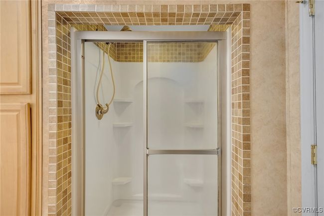 Full bath featuring a stall shower with tile | Image 18
