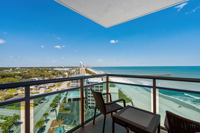 Balcony featuring a beach view and a water view | Image 29