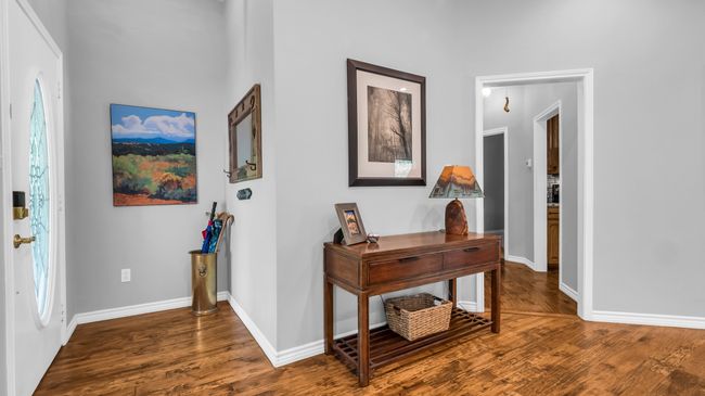 Foyer entrance featuring wood finished floors and baseboards | Image 4