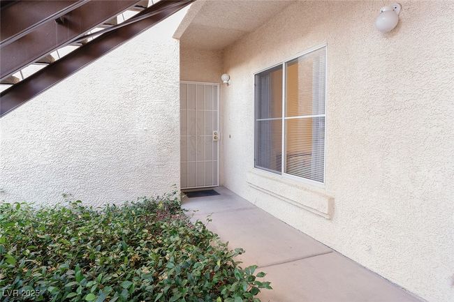 Doorway to property with jasmine flowers | Image 6