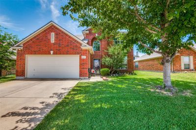 Front facade featuring a garage and a front lawn | Image 2