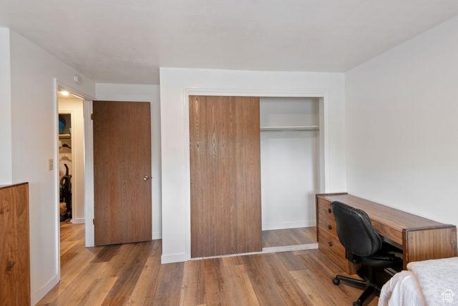 Home office with wood finished floors | Image 11