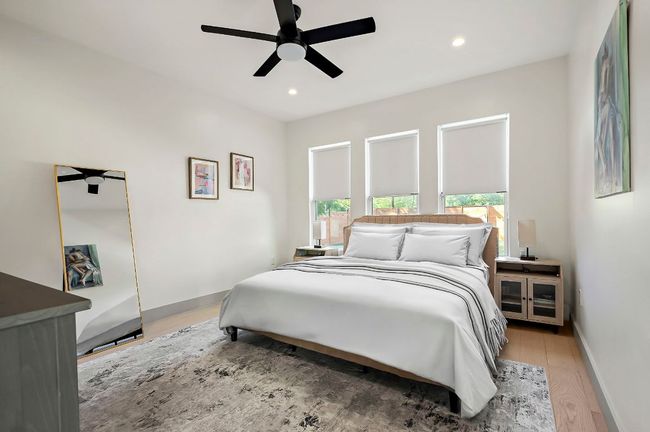 Bedroom featuring recessed lighting, light wood-style floors, baseboards, and ceiling fan | Image 17