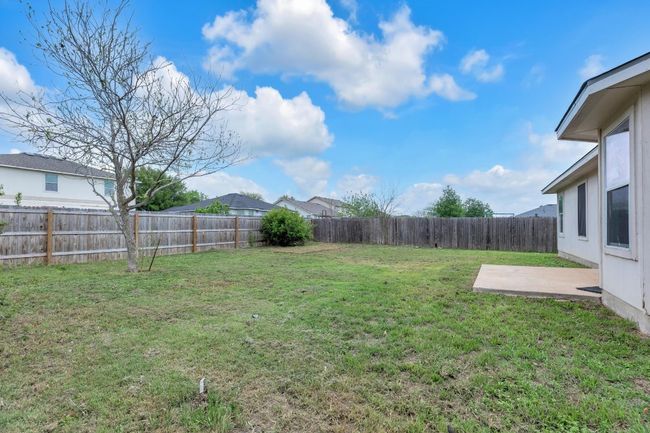 View of yard with a fenced backyard and a patio area | Image 19