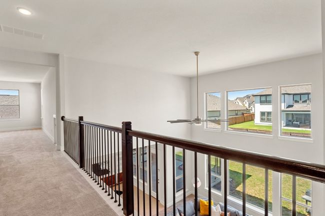 Corridor featuring carpet floors, visible vents, baseboards, and plenty of natural light | Image 22