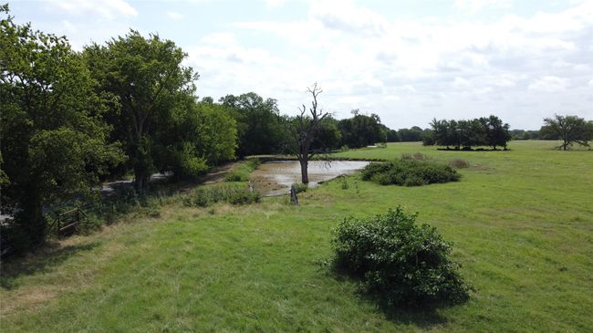 View of green lawn featuring a water view | Image 7