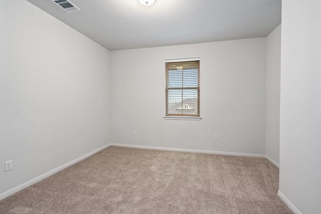 Unfurnished room with light carpet, baseboards, and visible vents | Image 31