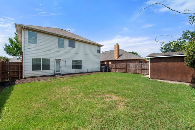 Rear view of house featuring a fenced backyard | Image 37