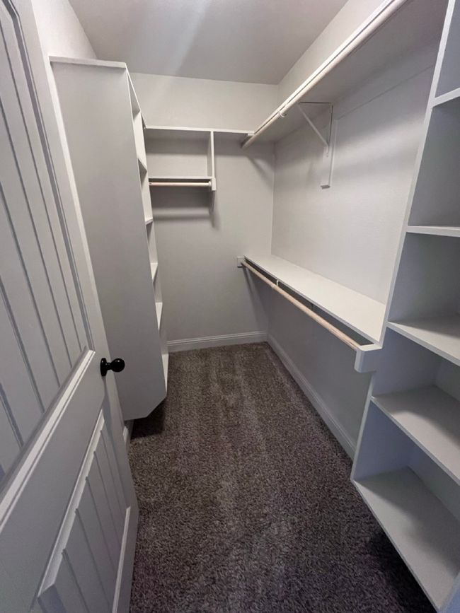 Walk in closet with carpet flooring | Image 37