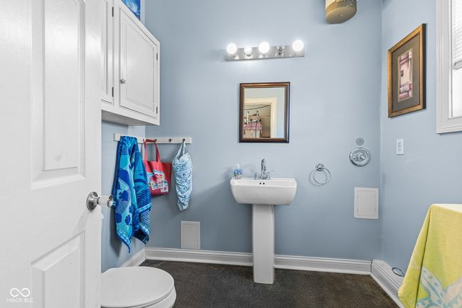 1/2 bathroom in the garage with water for outside shower while hanging out at your inground pool. | Image 59