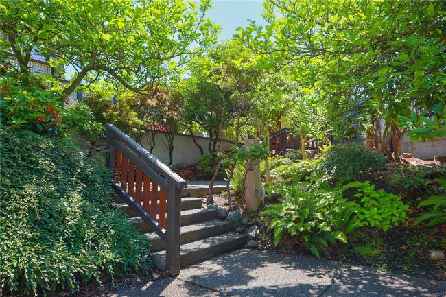 Stairs leading down to the swimming pool area | Image 52