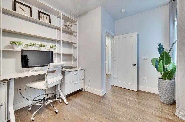 Office featuring light wood-style floors and baseboards | Image 12