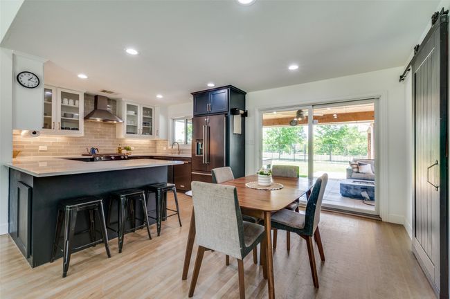 Door leads to backyard and covered patio! | Image 19
