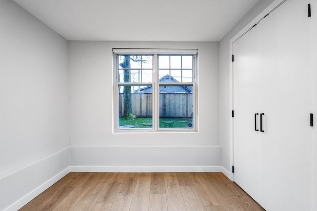 Spare room featuring baseboards and light wood-type flooring | Image 13