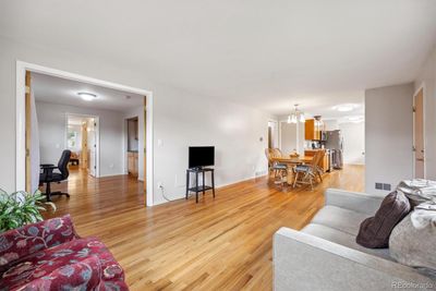 Living room open to dining area and kitchen. Great for entertaining. | Image 3