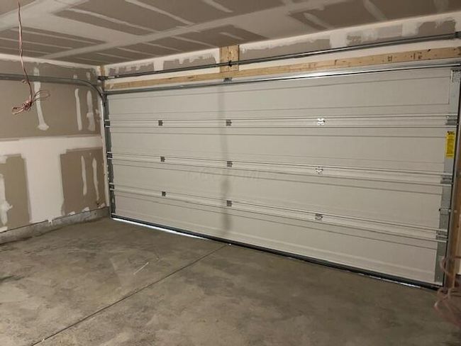 2 CAR GARAGE w/INSULATED OVERHEAD GARAGE DOOR & FULLY DRYWALLED INTERIOR | Image 47