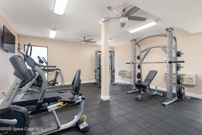 Exercise room with mujltiple machines | Image 41