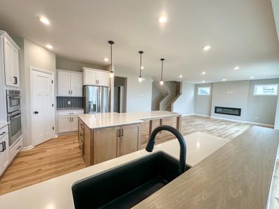 The spacious morning room floods the kitchen/living room with warm sunlight! | Image 3