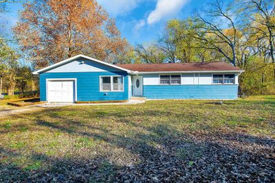 Single story home with a garage and a front lawn | Image 1