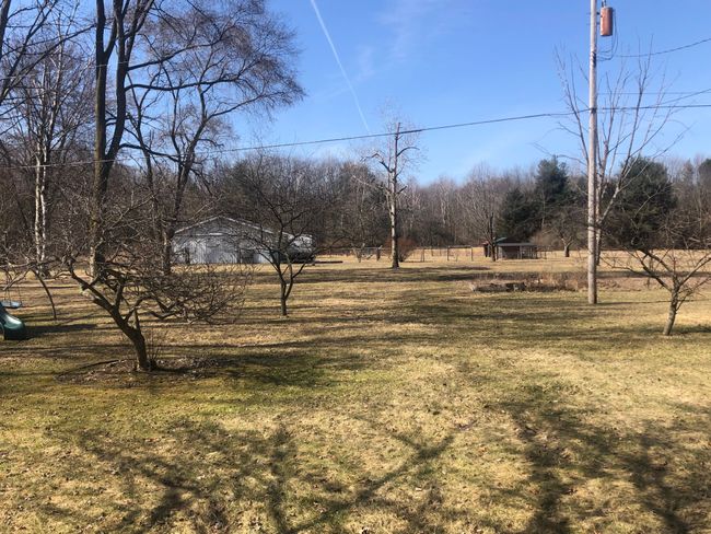 View of property with barn and corrals in distance | Image 52