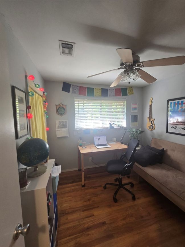 Office with wood finished floors and a ceiling fan | Image 14