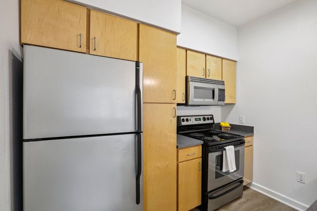 Kitchen offers plenty of cabinet space. | Image 13