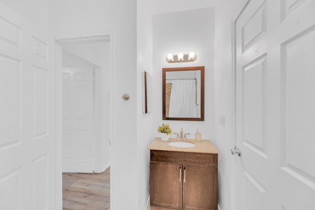 Bathroom with vanity and wood finished floors | Image 21
