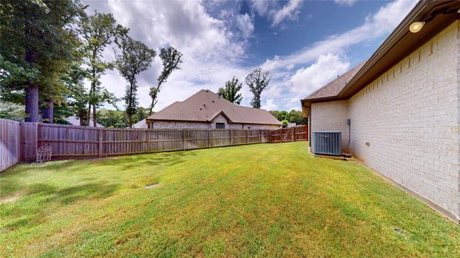 View of fenced backyard | Image 37
