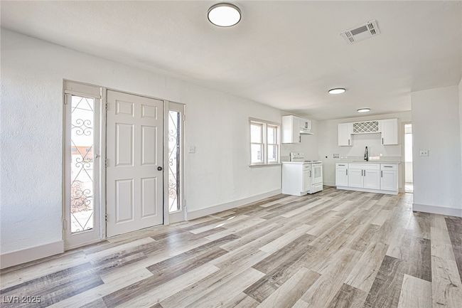 Foyer featuring light wood finished floors and baseboards | Image 6