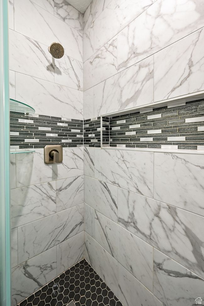 Bathroom with a tile shower | Image 81