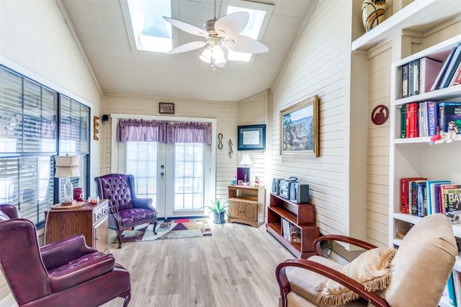 Enjoy the warm sunshine in the lovely sunroom | Image 9