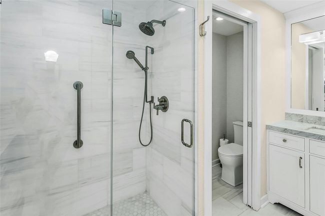 Full bath with a shower stall, toilet, and vanity | Image 15