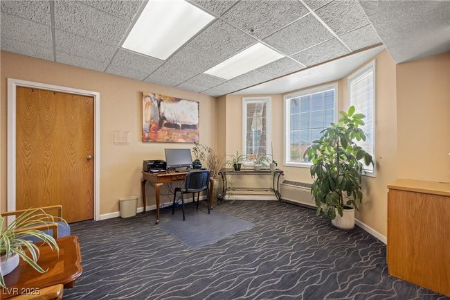 Common Office featuring plenty of natural light, baseboards, and carpet floors | Image 28