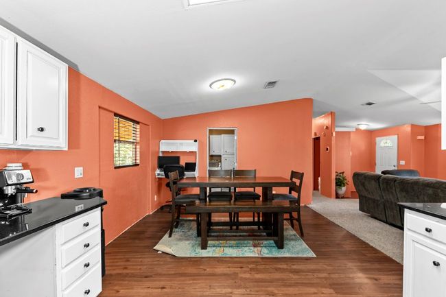 Dining space featuring wood finished floors | Image 12