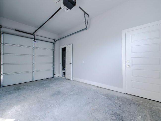 Garage featuring a garage door opener | Image 24