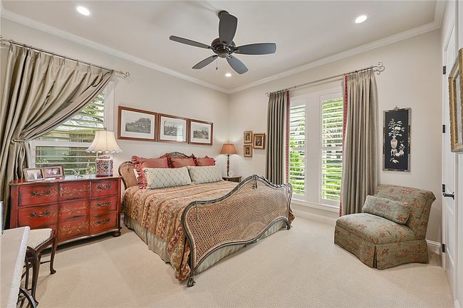 Bedroom featuring carpet, recessed lighting, a ceiling fan, and ornamental molding | Image 7