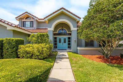 Grand entrance through manicured front lawn | Image 3